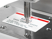 Closeup of Q-Card peel tester embossed character test